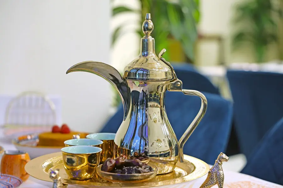 Arabic coffee served from a traditional pot
