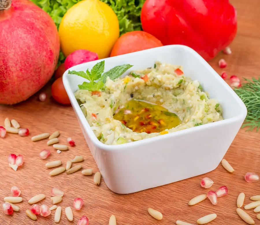Smoky aubergine dip served in a shallow bowl