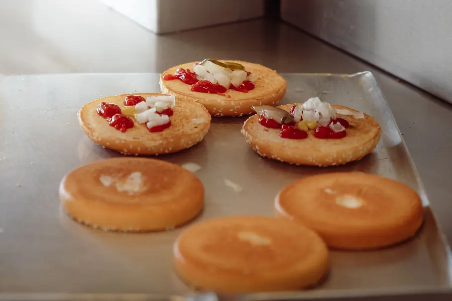 Burger buns on a baking tray