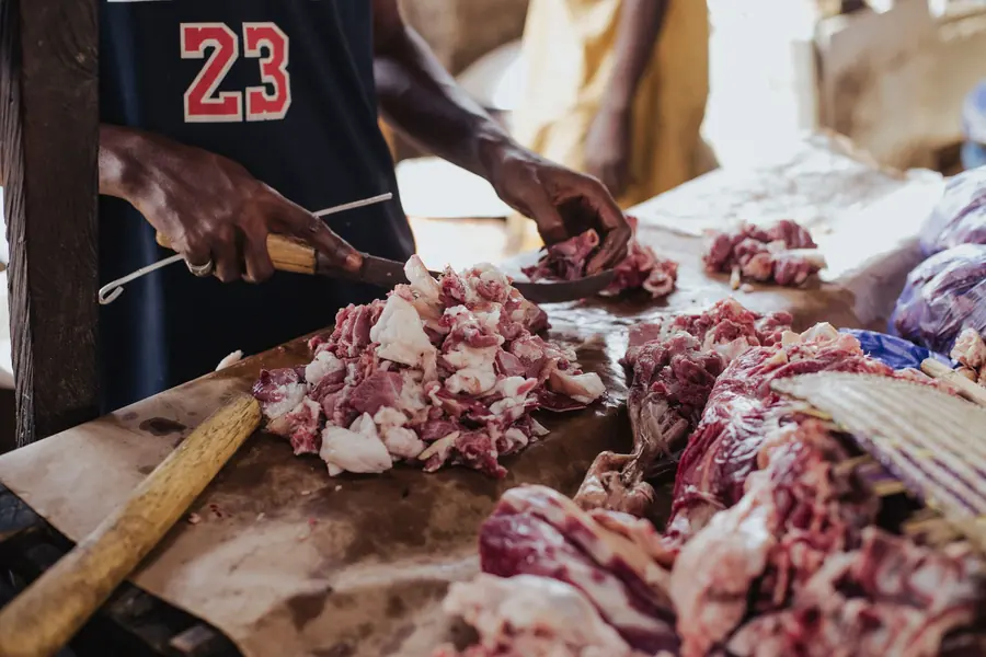 A butcher cutting meat