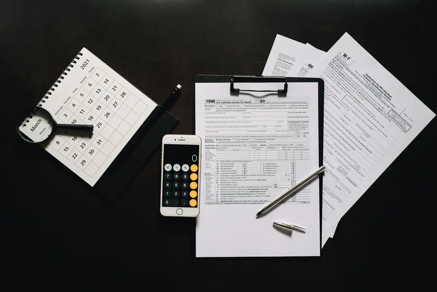 A calendar and calculator on a desk