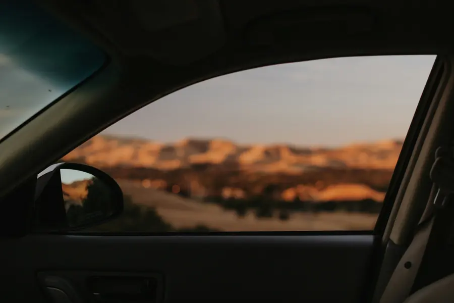 The view through a car window on a road trip