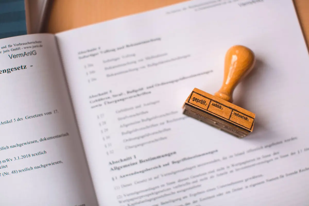 A certificate and stamp on a desk