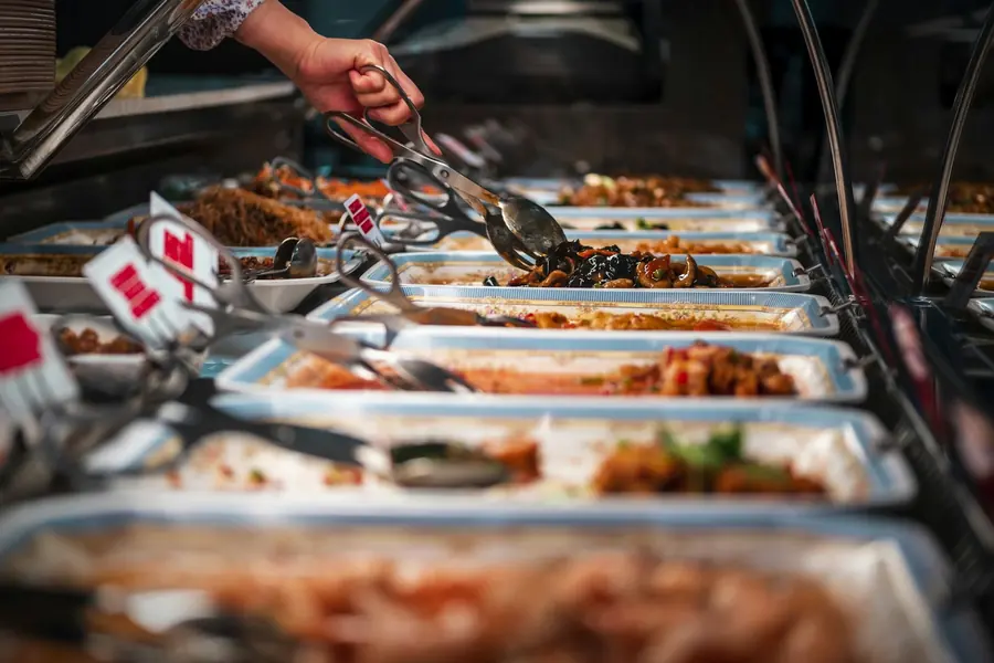 Chafing dishes keeping food warm on a buffet line