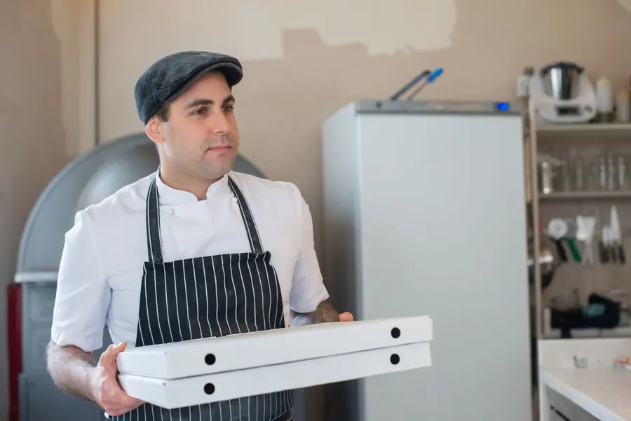 A chef checking a delivery