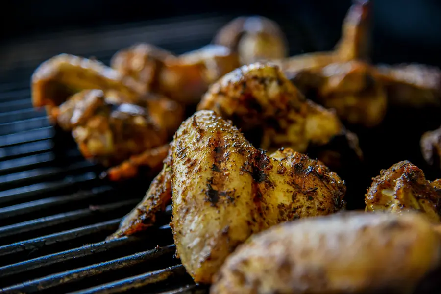 Chicken cooking over a grill