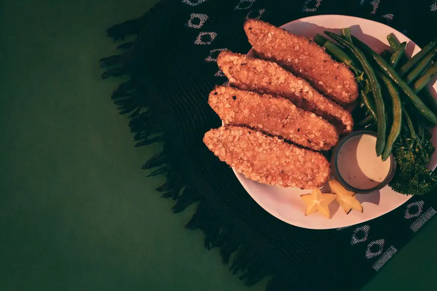 Breaded chicken tenders served on a plate