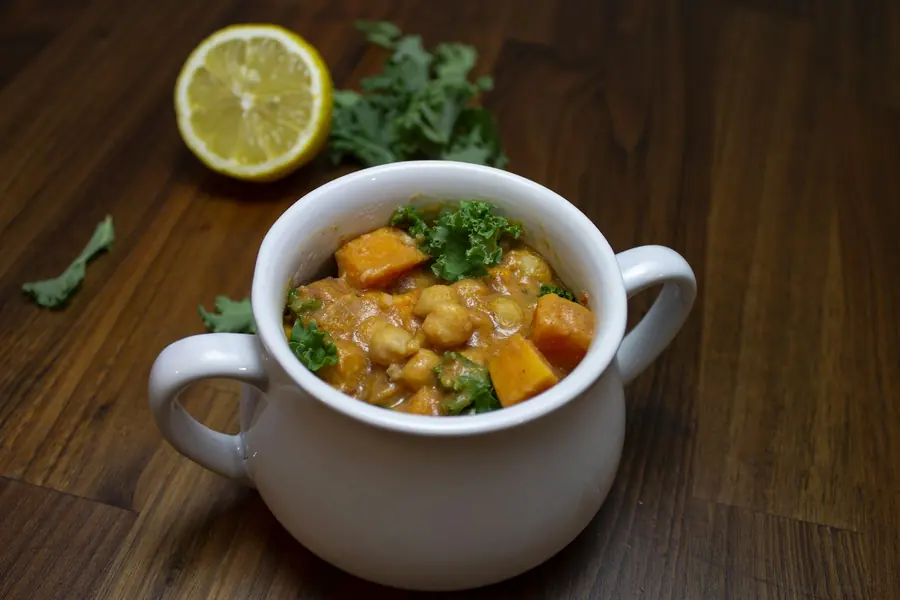 A bowl of chickpea salad with lemon and parsley