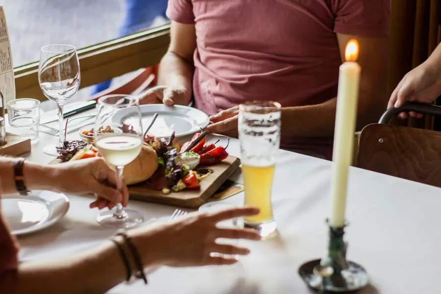 Two people eating together at a restaurant