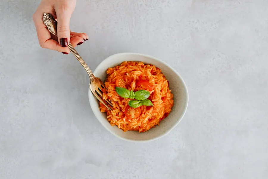Eating from a bowl with a fork