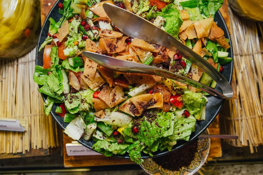 Fattoush salad topped with crisp pieces of pita