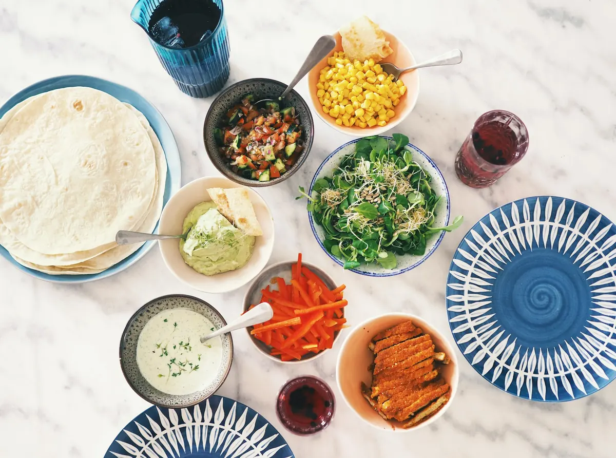 A wrap, a bowl and a plate served together