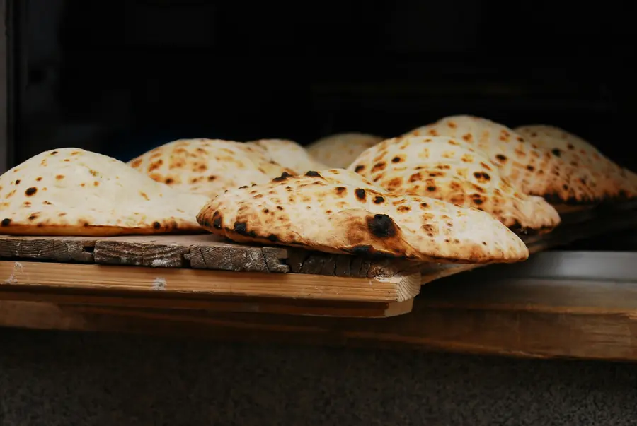 Fresh flatbreads coming out of the oven