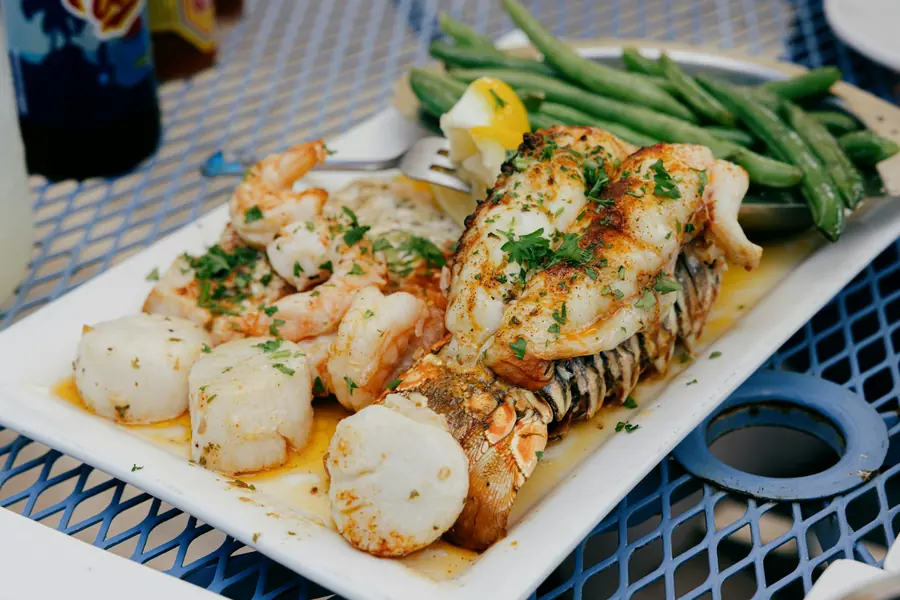 A grilled fish fillet served with lemon