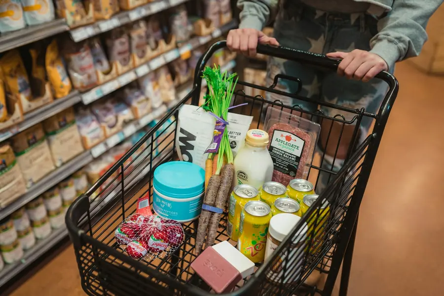 A shopping basket of groceries in a store
