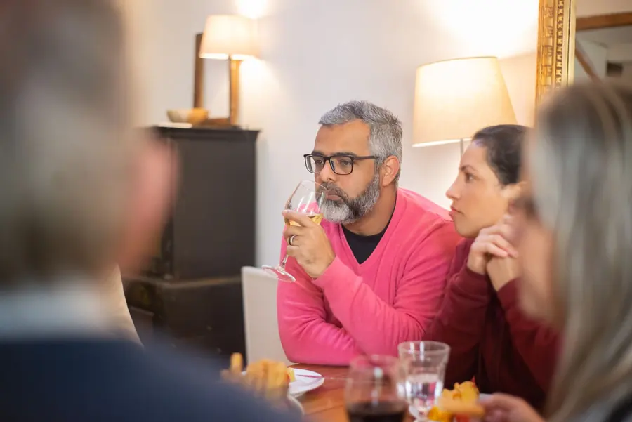 Guests talking around a dinner table