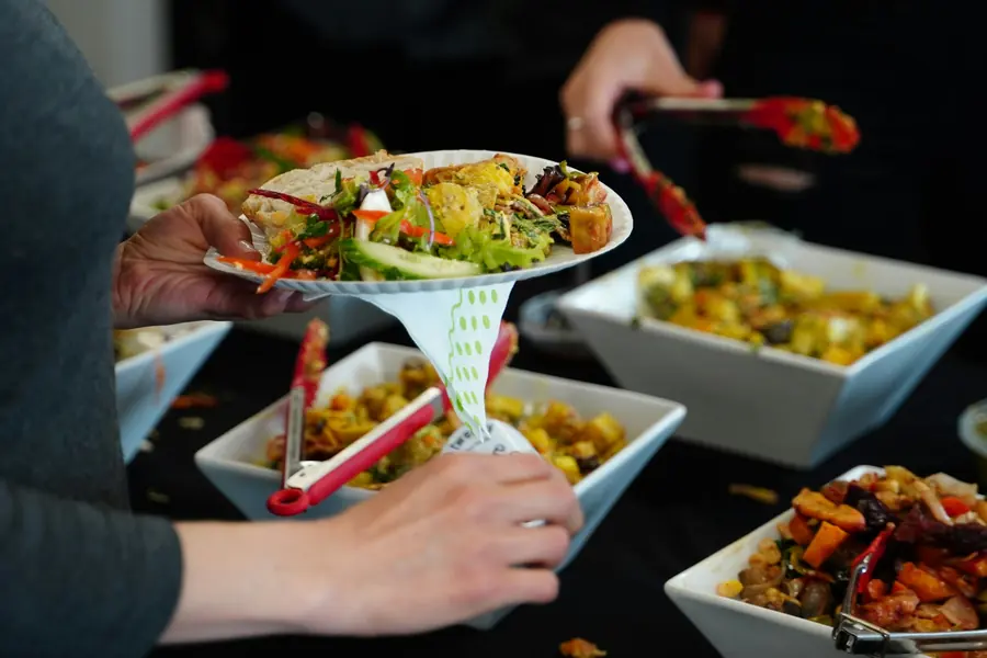 Guests helping themselves along a buffet line