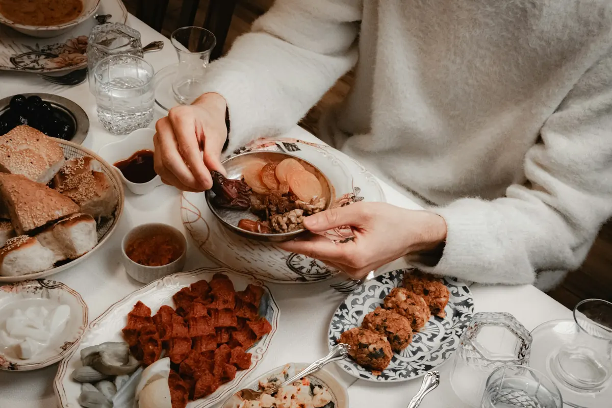 An iftar table set with dates and shared dishes