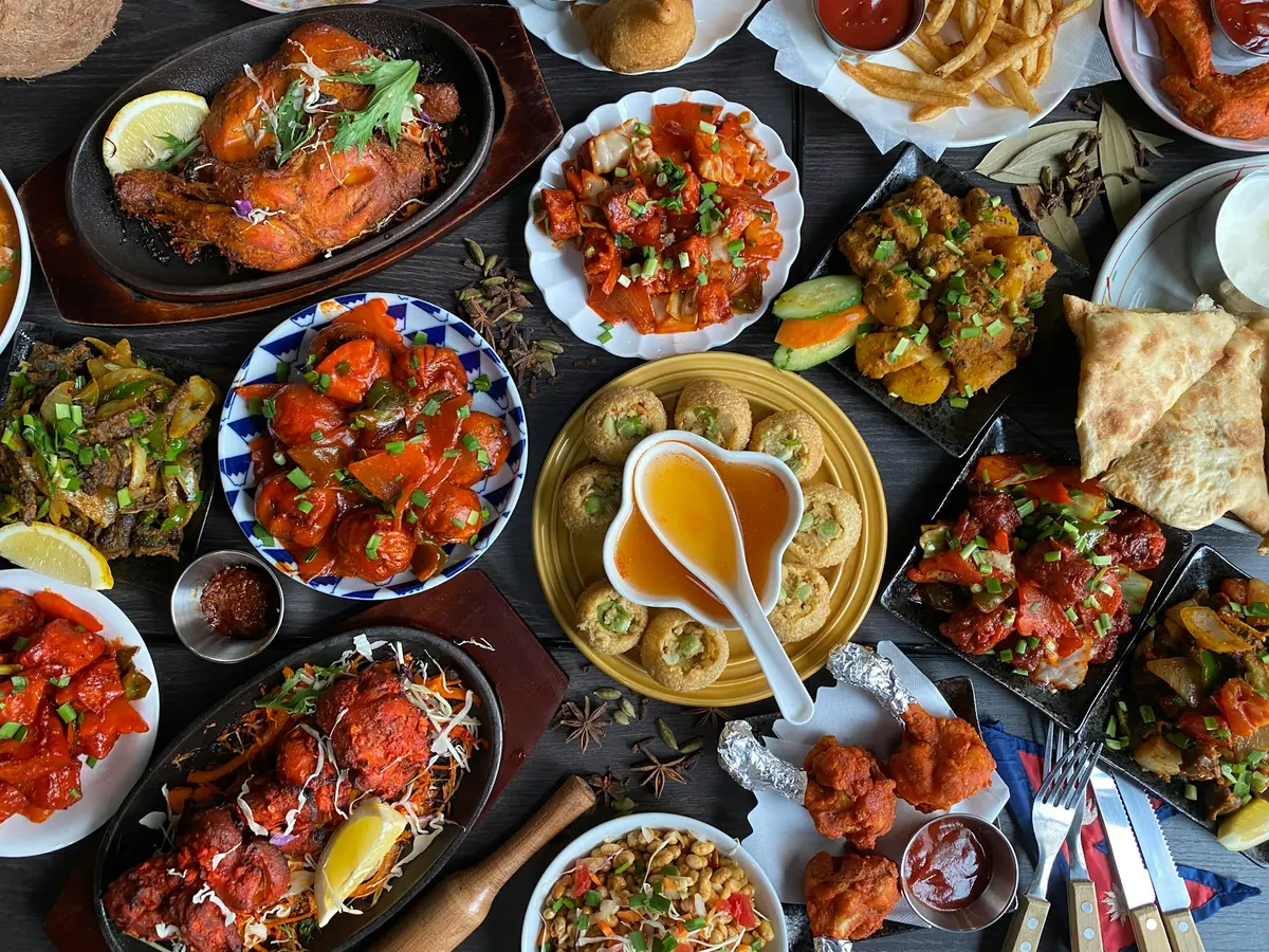 A spread of Indian curry dishes on a table