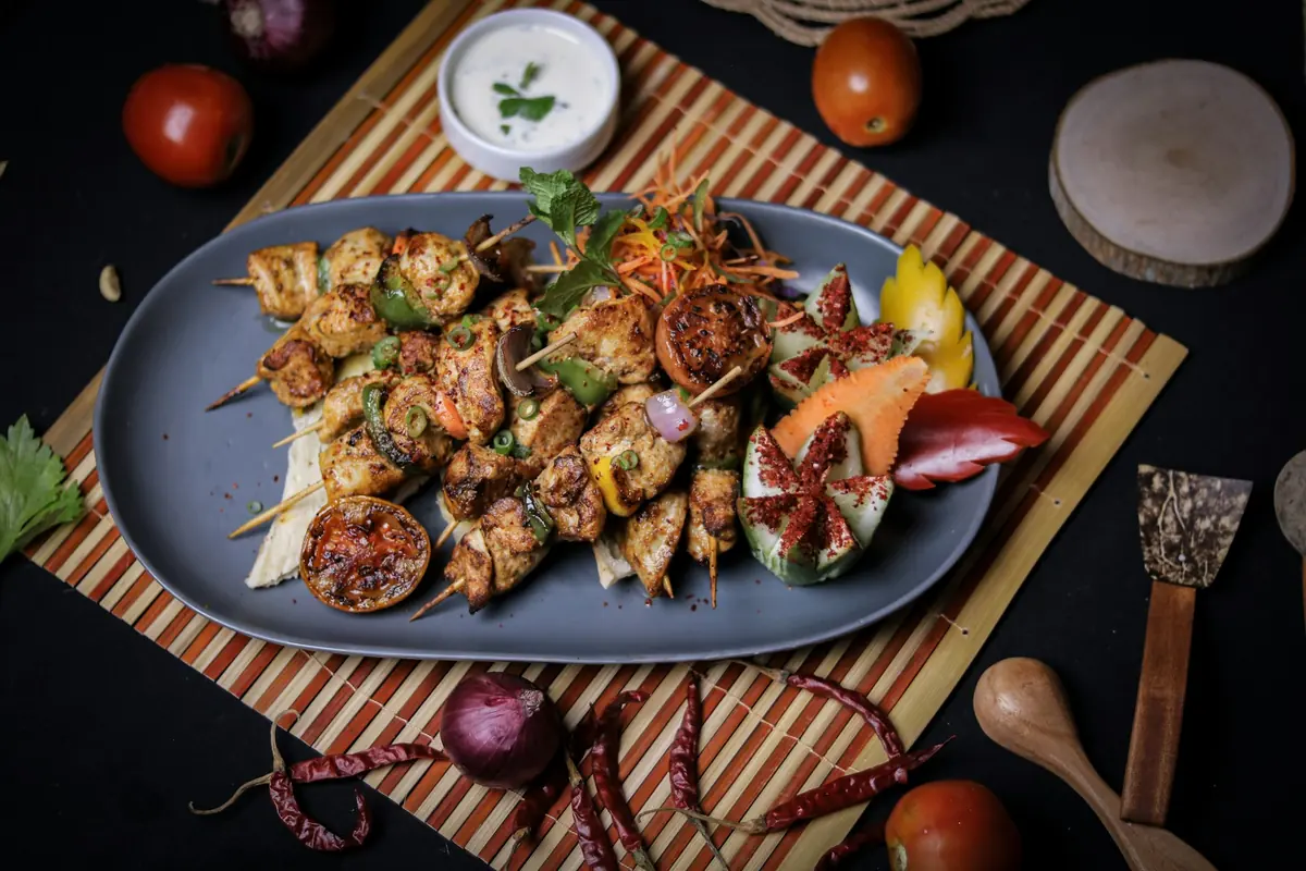 A platter of assorted grilled kebab skewers