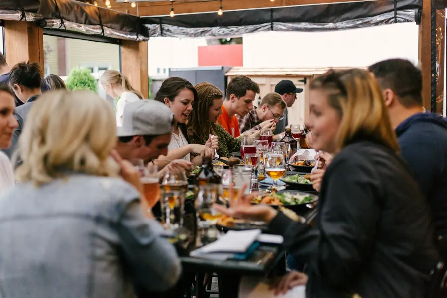 Guests seated along a long table for a large gathering