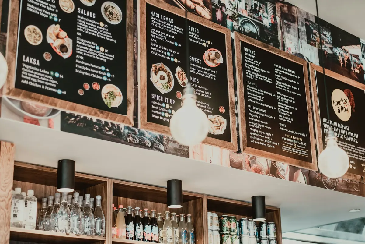A menu board mounted above a restaurant counter