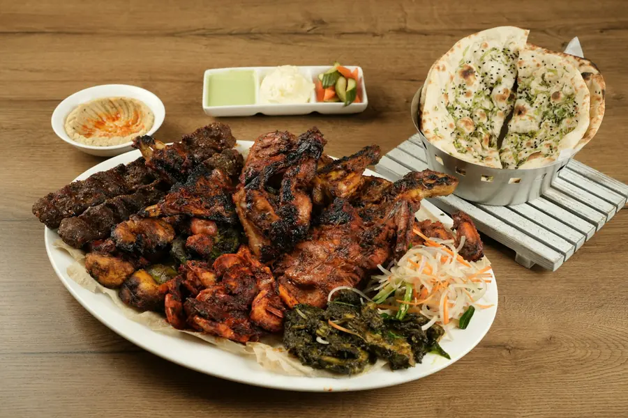 A large mixed grill platter arranged for sharing