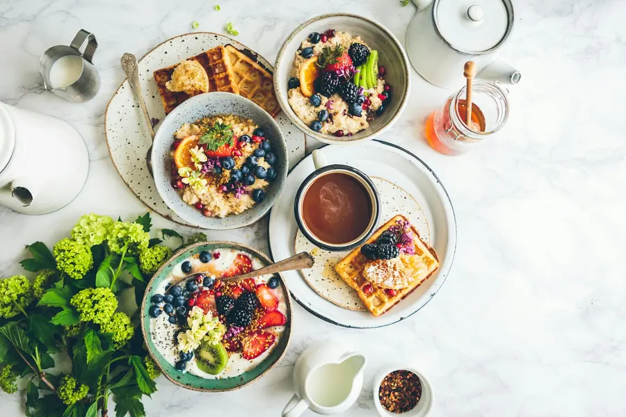 A variety of plates of food on a table