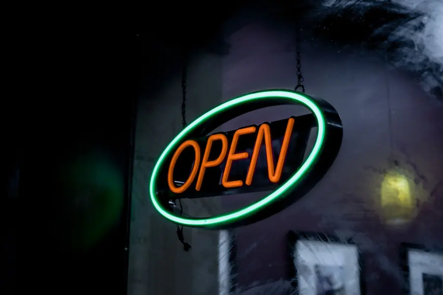 A neon open sign in a window