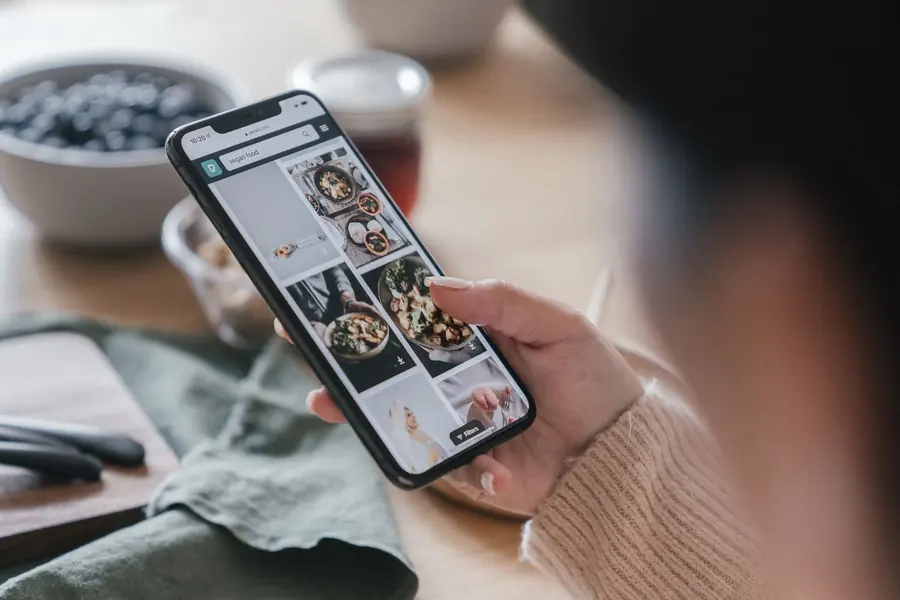 Checking a restaurant on a phone before visiting