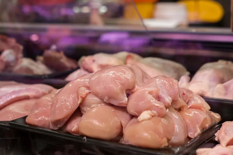 Packaged chicken in a refrigerated display
