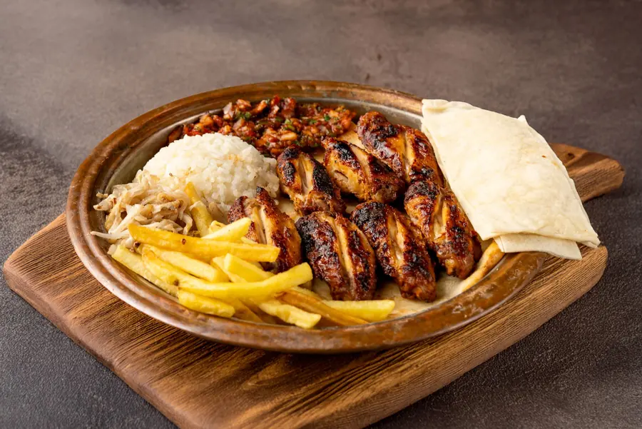 A simple plate of plain rice with grilled chicken