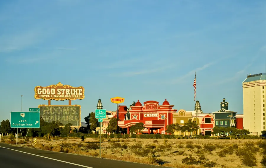 A roadside restaurant sign near a highway exit