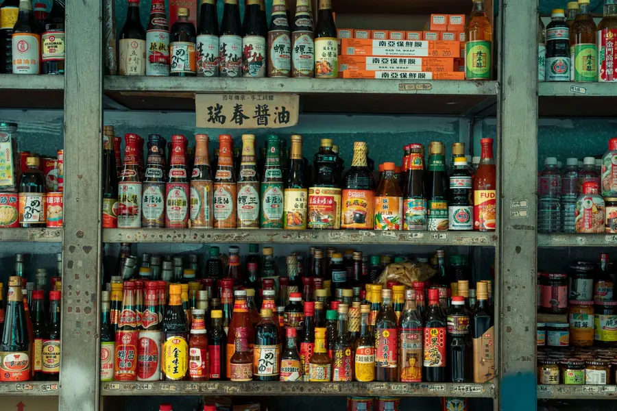 Bottles of sauces and condiments on a shelf