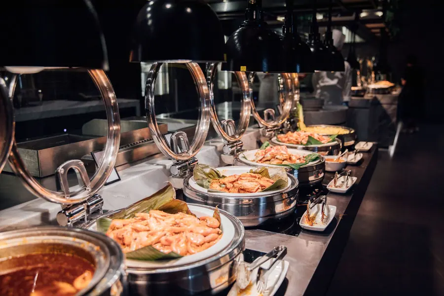 Serving spoons resting in dishes