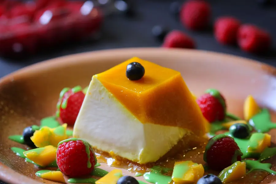 A set cream dessert turned out onto a plate