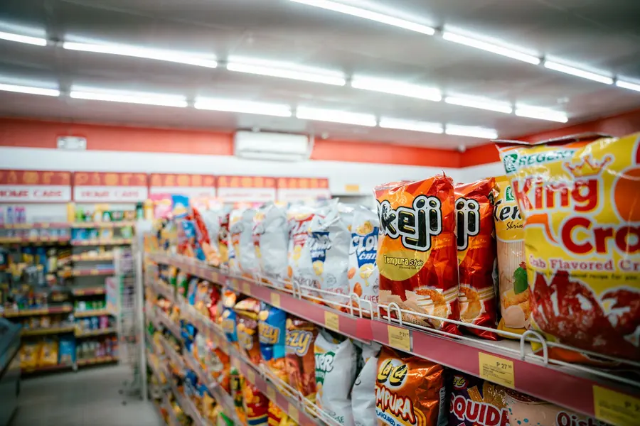 Packaged snacks on supermarket shelves