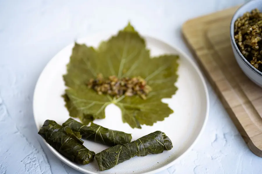 Stuffed vine leaves arranged on a plate