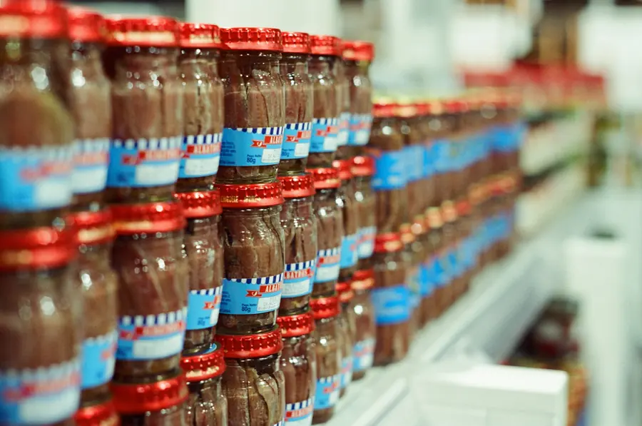 Shelves of packaged food in a supermarket aisle