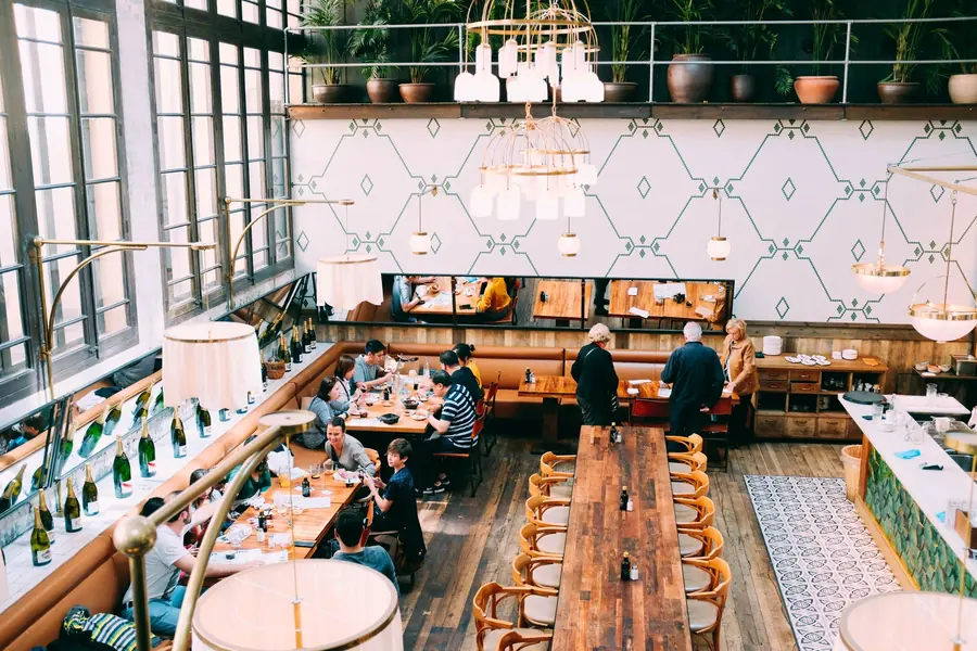 A restaurant table laid for a group