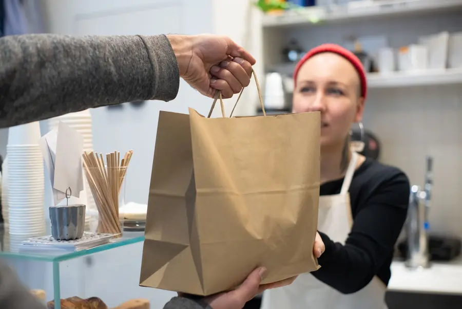 A takeout order bagged and waiting on the counter