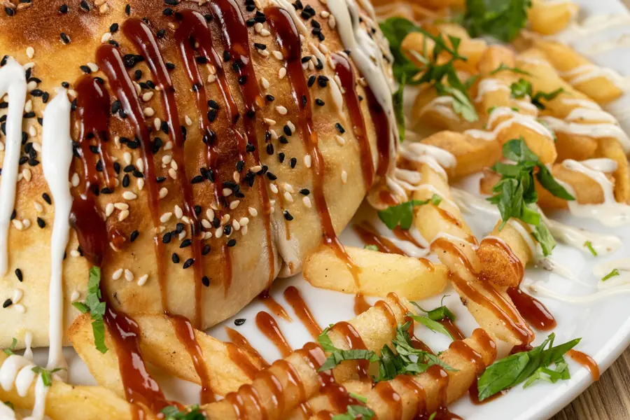 White sauce drizzled over food