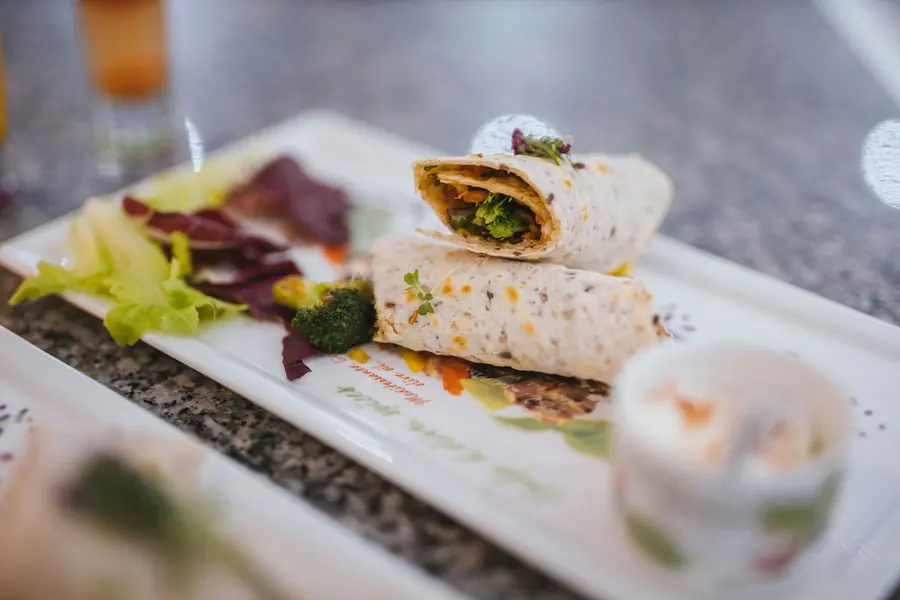 A wrap cut in half showing the filling
