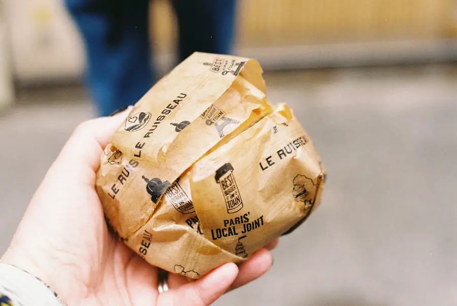 A wrap held in one hand, ready to eat