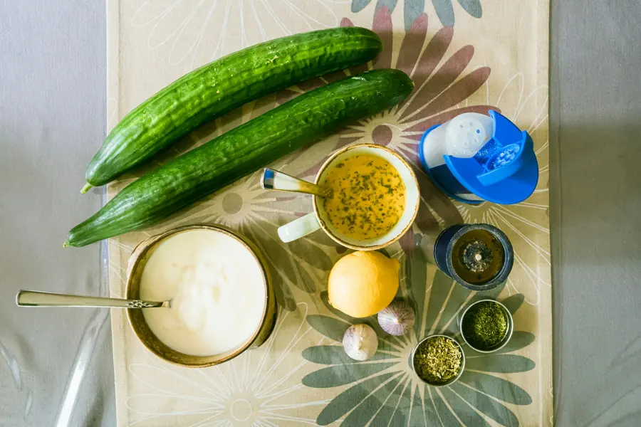 Yogurt, cucumber and fresh dill being prepared